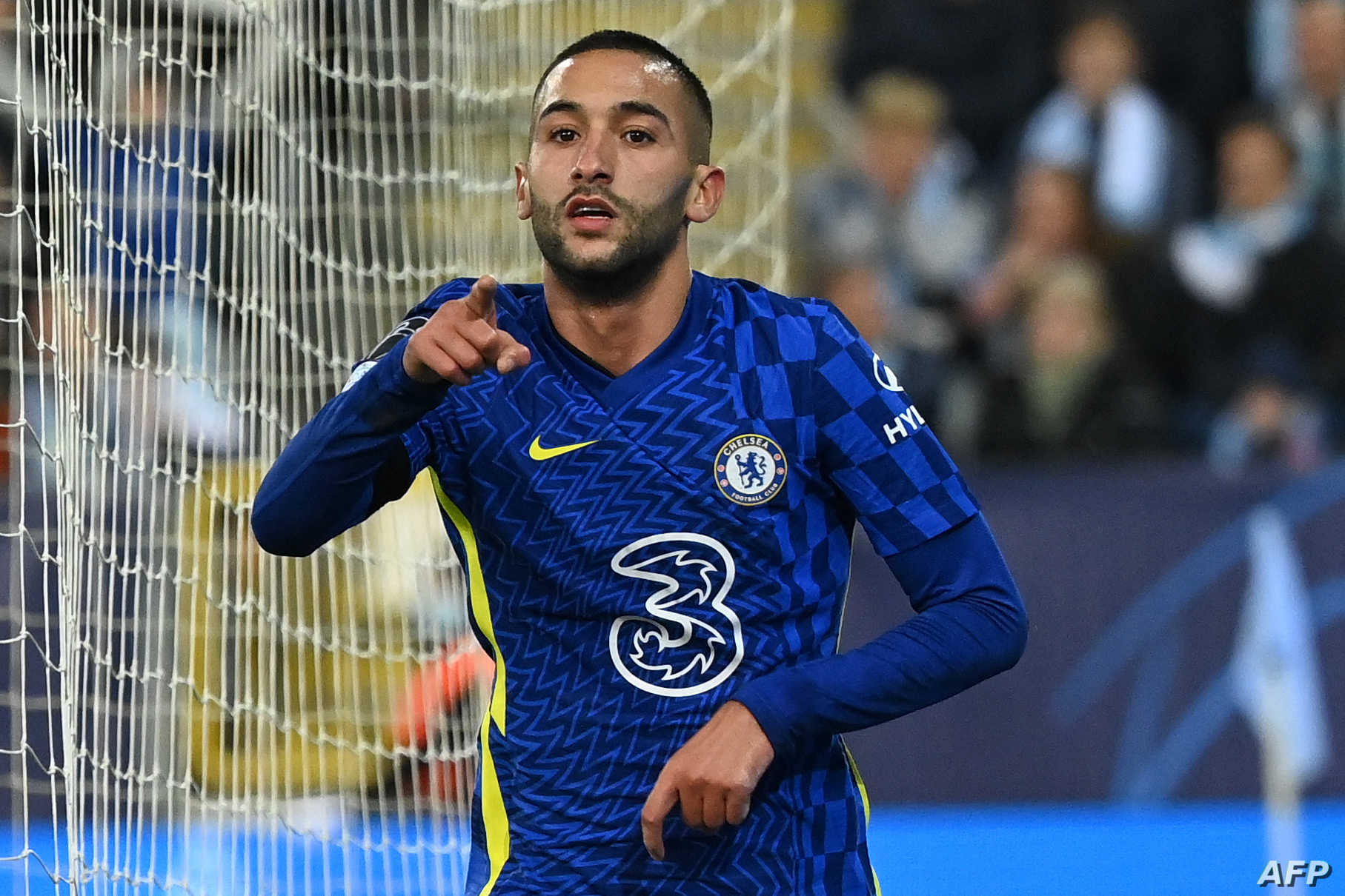 Chelsea's Moroccan midfielder Hakim Ziyech celebrates scoring the opening goal during the UEFA Champions League group H football match Malmo FF v Chelsea FC in Malmo, Sweden on November 2, 2021. (Photo by Jonathan NACKSTRAND / AFP)